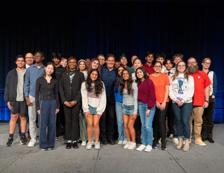 Mark Cuban and Charlotte Dungan pose with local Pittsburgh students from AI Bootcamp