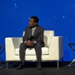 Kate Maloney, Adonias Tadesse, and Angeline Le onstage at Infosys gala