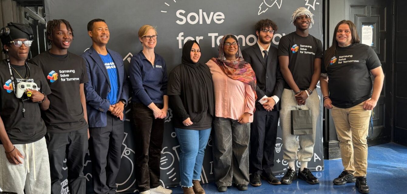 Charlotte Dungan, Chief Learning Officer at the Mark Cuban Foundation poses with students at Samsung Solve for Tomorrow event