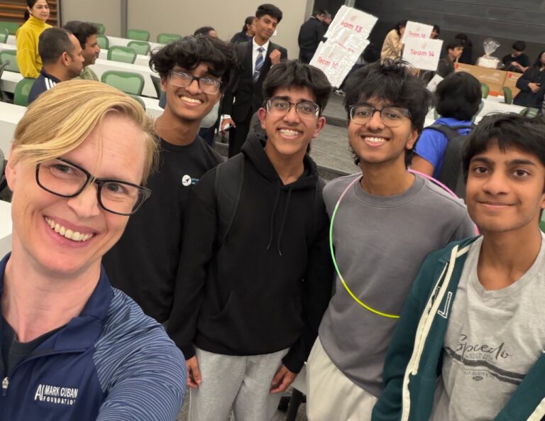 Charlotte Dungan poses with Hackathon students at UTD